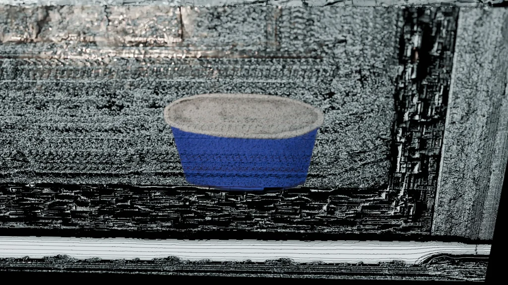 金属のような物体にアイスクリームの容器が描画されている。表は凹凸激しい